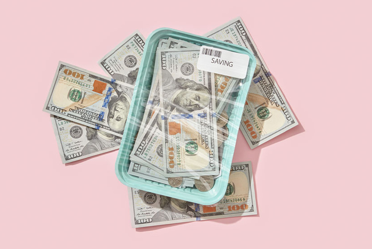Money in a plastic container with a sticker that says 