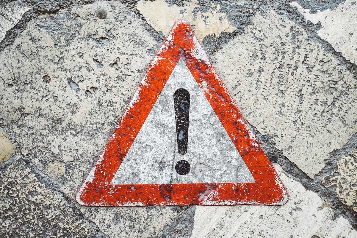Concrete background with caution symbol