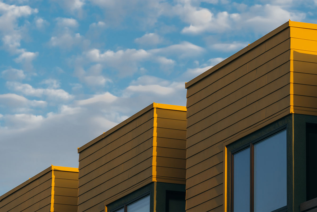 Yellow houses against blue sky