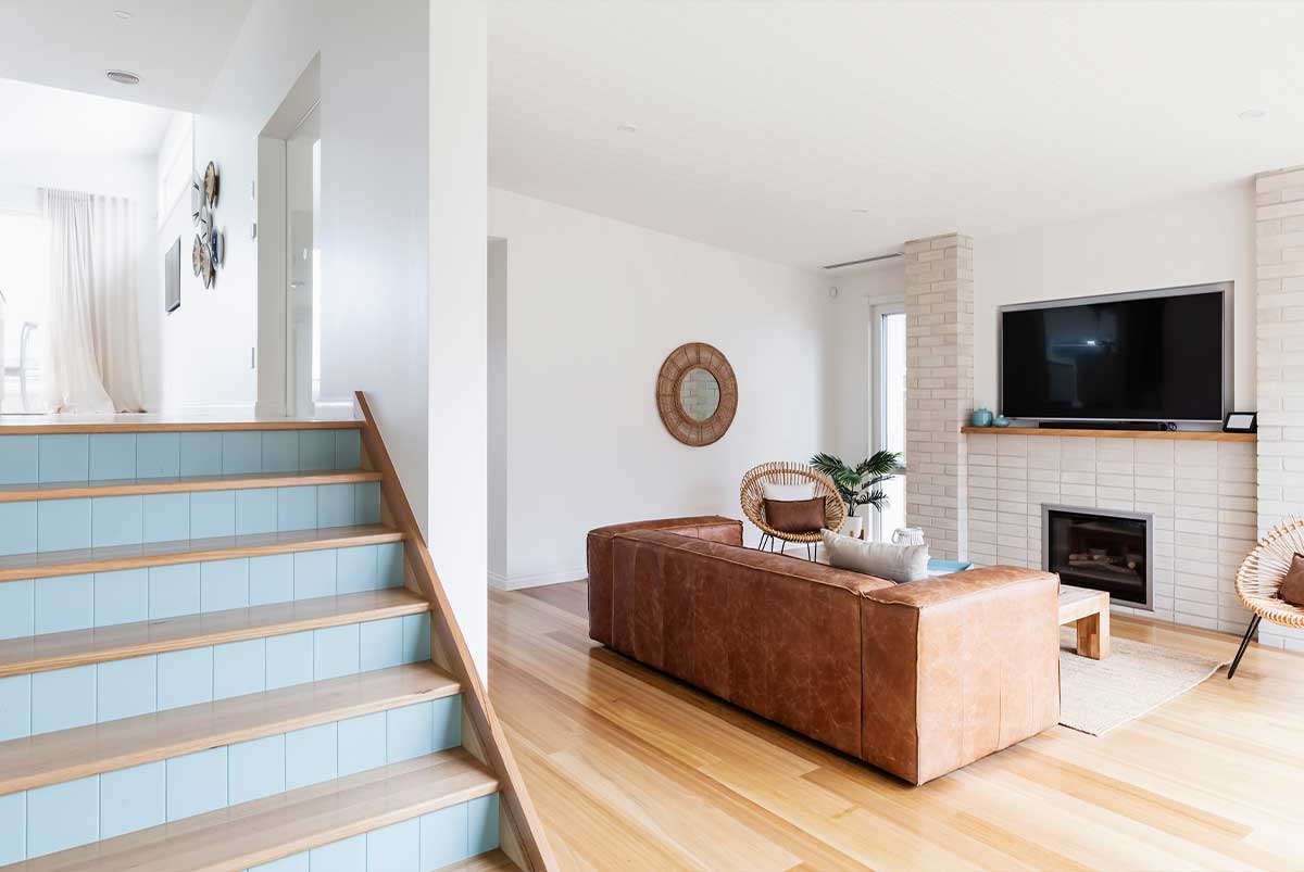 Interior of a split level house showing staircase to downstairs living room