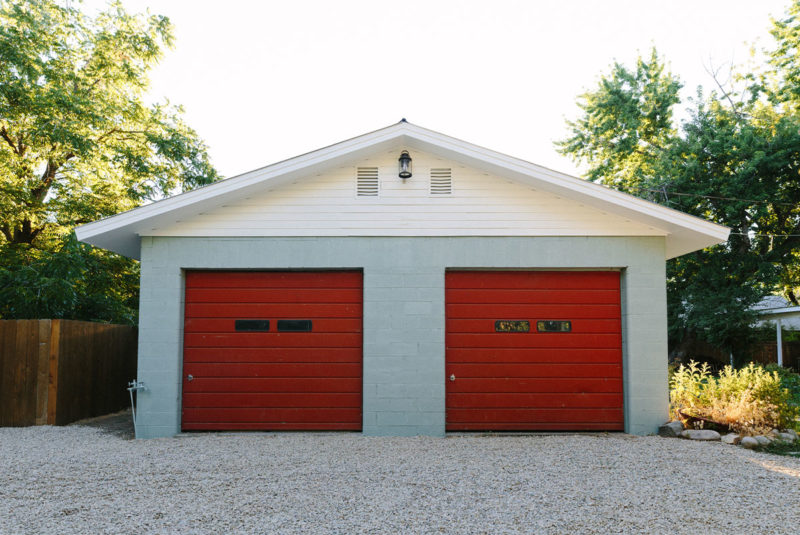 garage with 2 red overhead doors