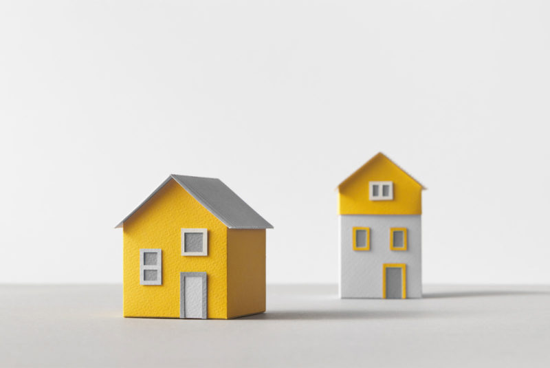 two houses looking at differences between HELOC and Home Equity Line of Credit