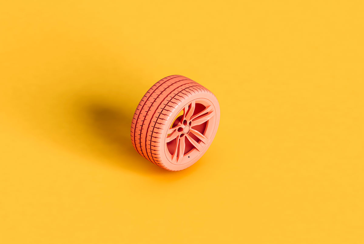 Pink tire on a yellow background