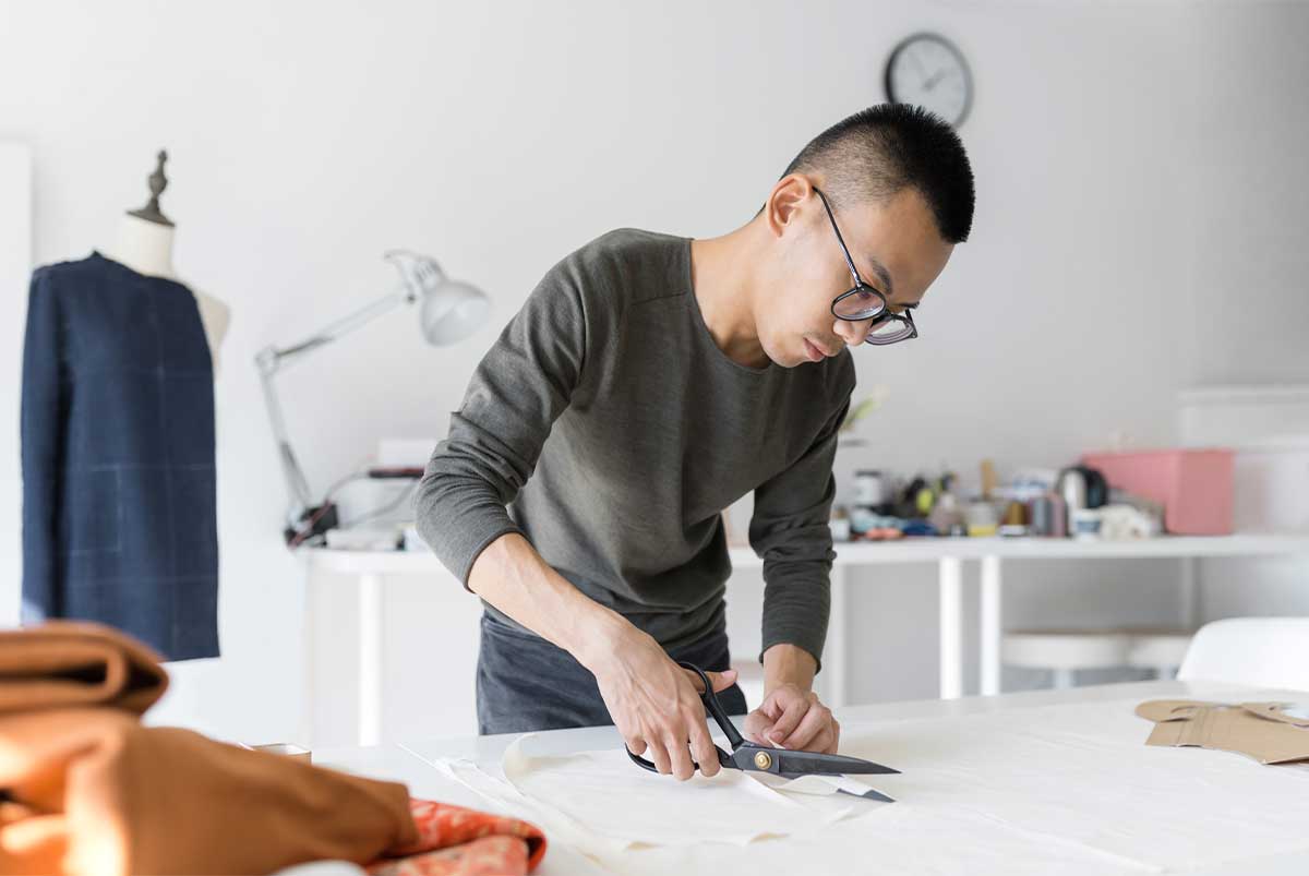 Man cutting fabric