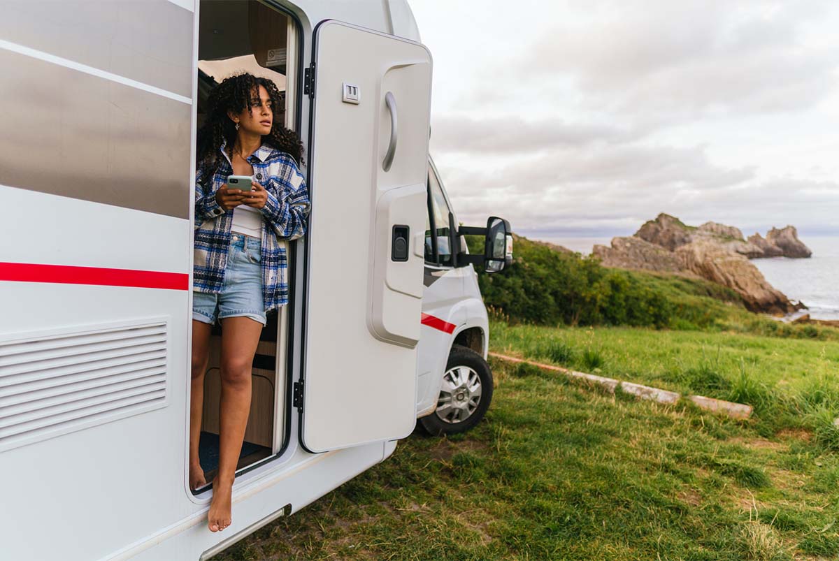 Young woman looking out of RV
