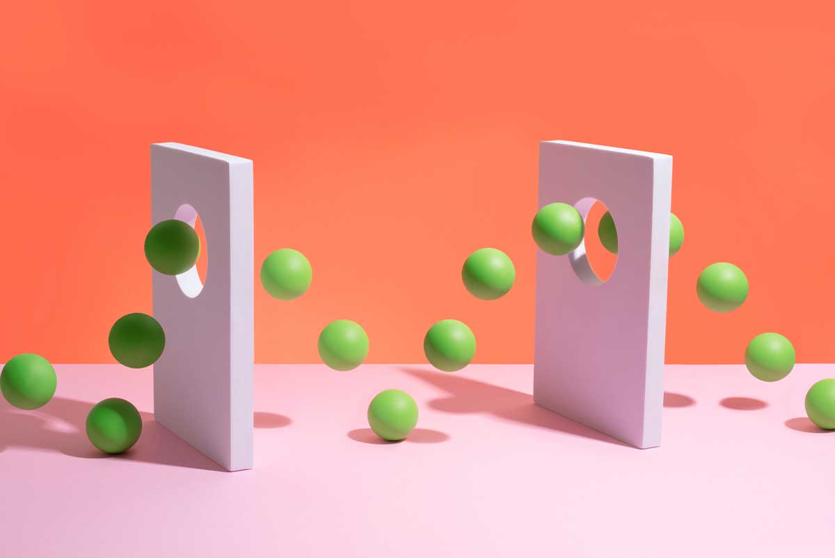 Green bouncy balls bouncing through cutouts