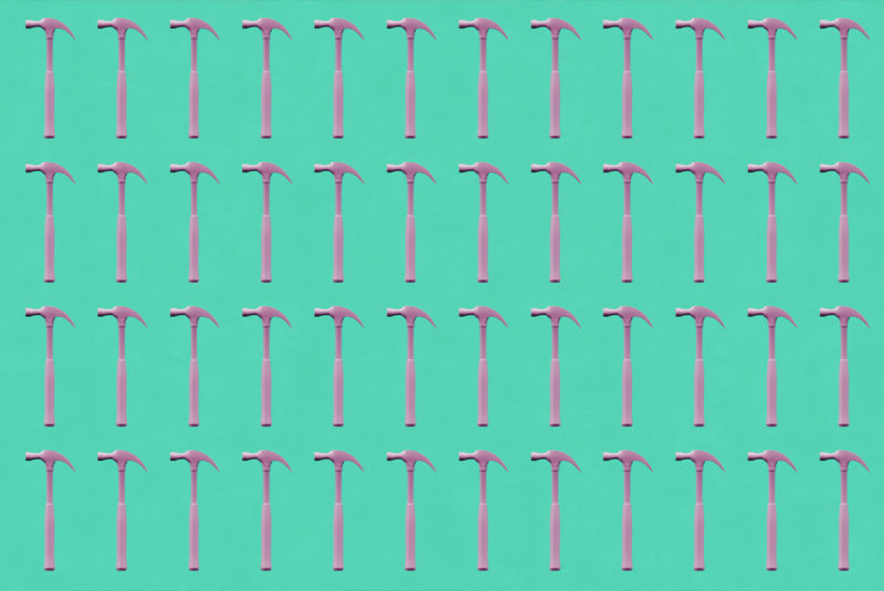 Four rows of hammers on a teal background.