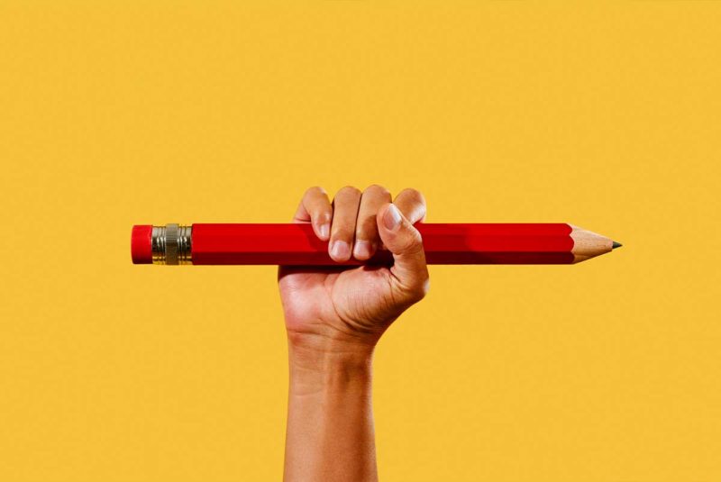 Hand with giant pencil