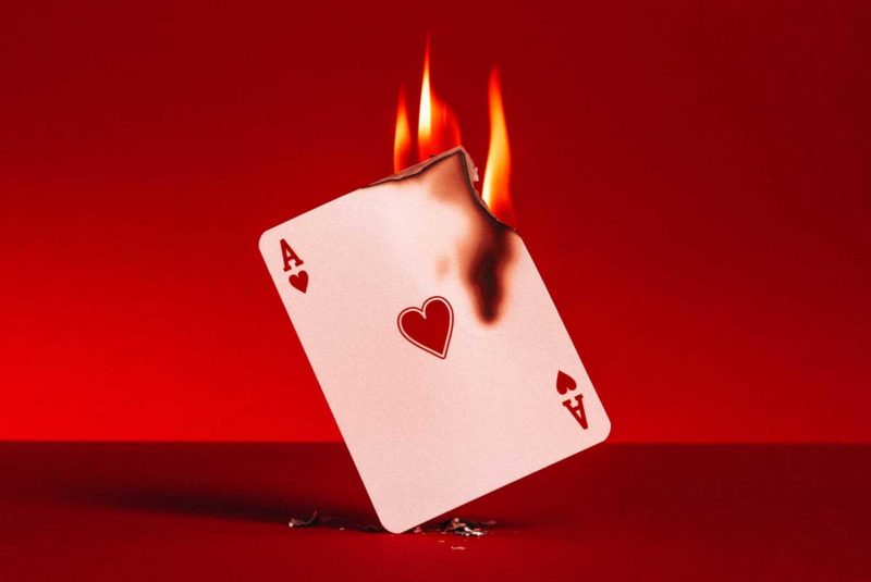 The Ace of Hearts card on fire
