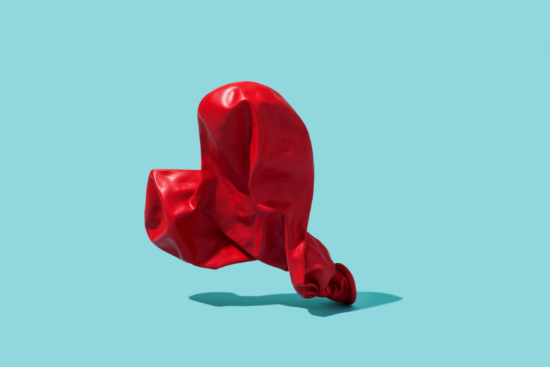 A deflated heart-shaped balloon