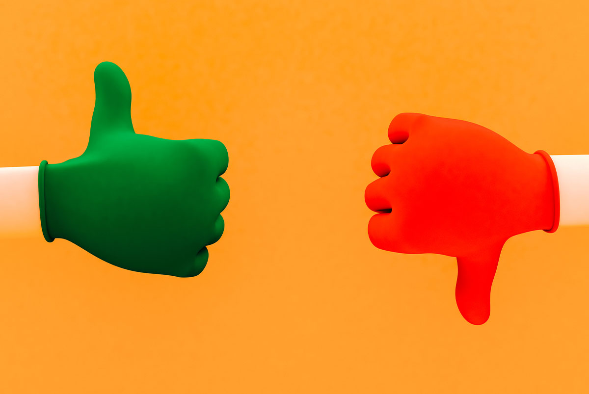 Orange background with a red thumbs down and a green thumbs up