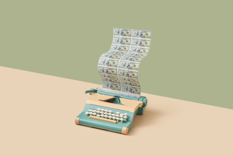 Retro typewriter printing dollar bills
