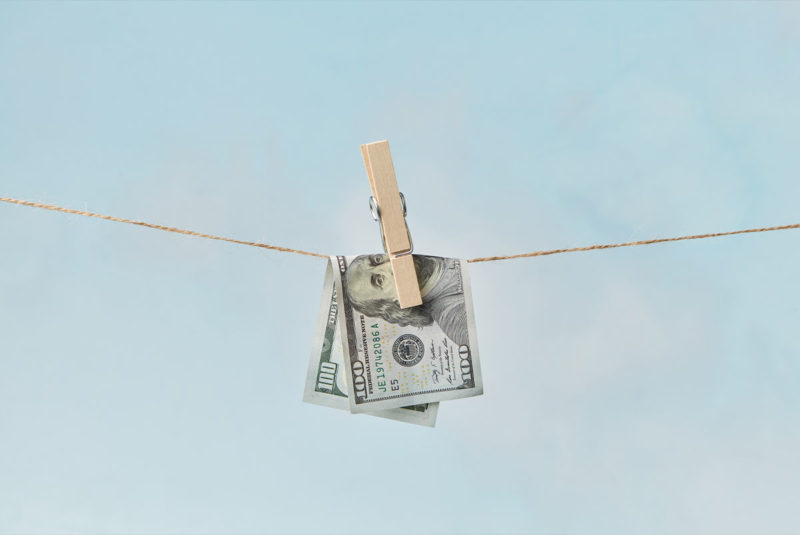 Dollar bill drying on clothesline