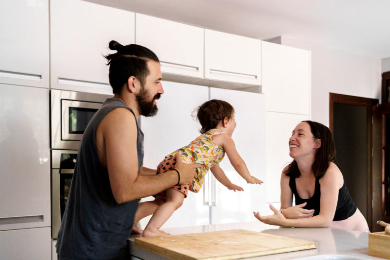 Couple in a kitchen with their baby