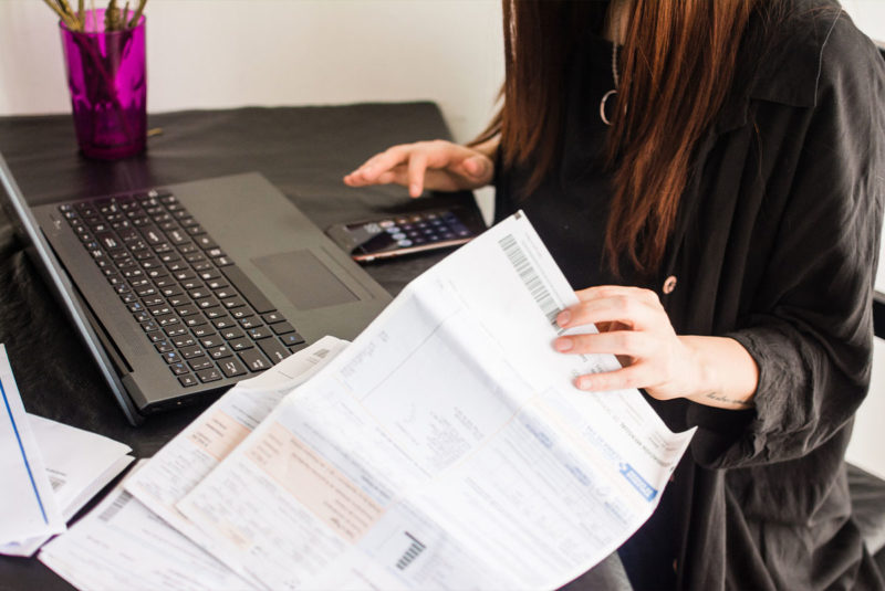 Woman going through mortgage papers