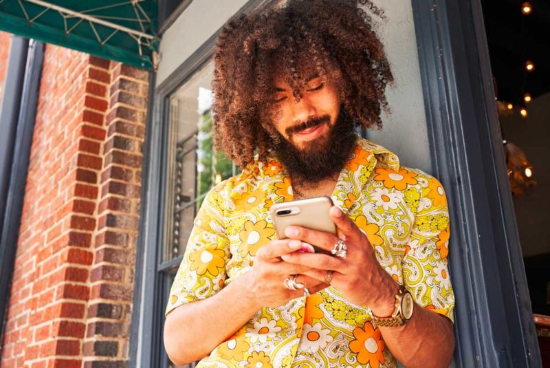 Guy with beard on cell phone