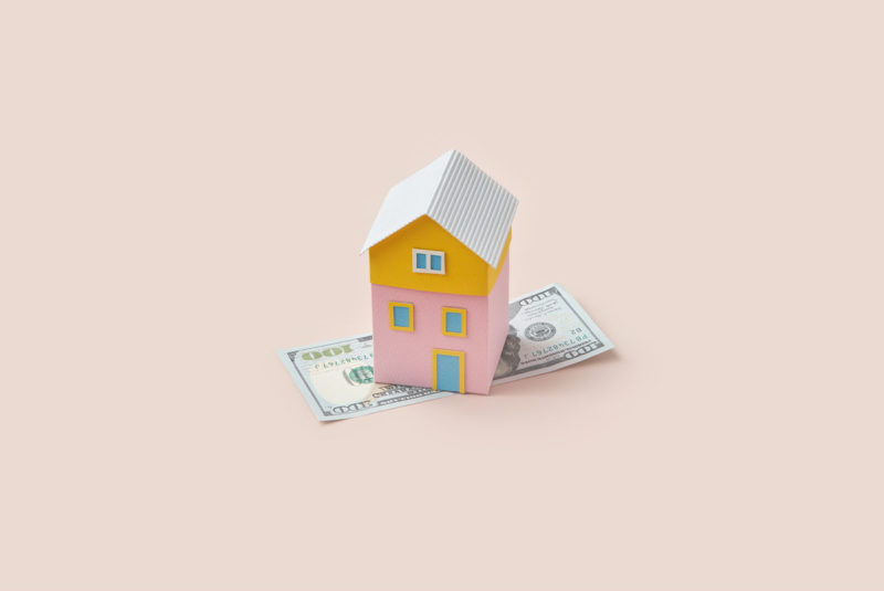 Multicolored paper house over 100 dollars