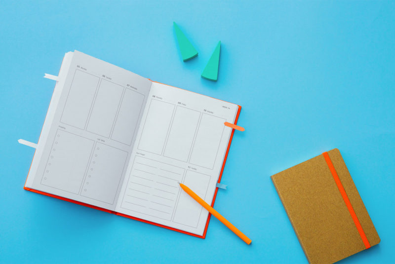 planners with pen to work out how long to buy a house