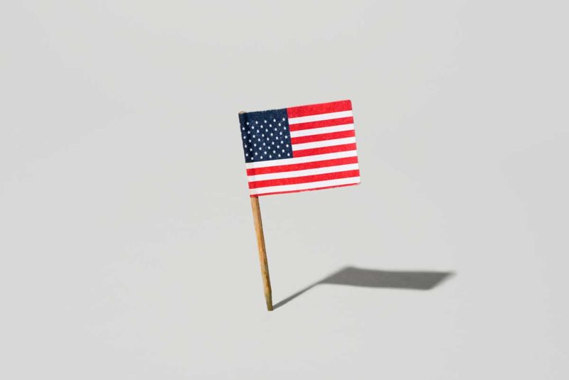 A small American flag tchotchke against a white background