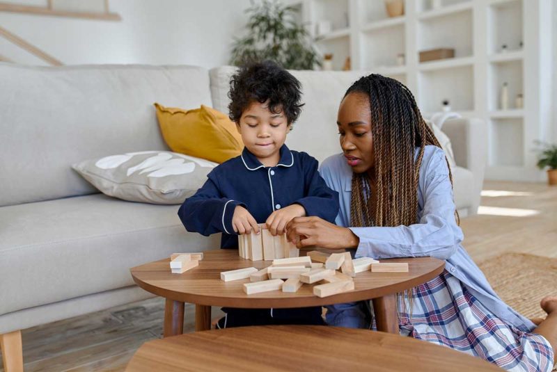 Woman and child playing with blocks